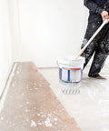 Person using a Lightweight Small Paint Roller With Ergonomic Handle For Fast Wall Coverage and Crisp Clean Edges on a baseboard.