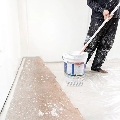 Person using a Lightweight Small Paint Roller With Ergonomic Handle For Fast Wall Coverage and Crisp Clean Edges on a baseboard.