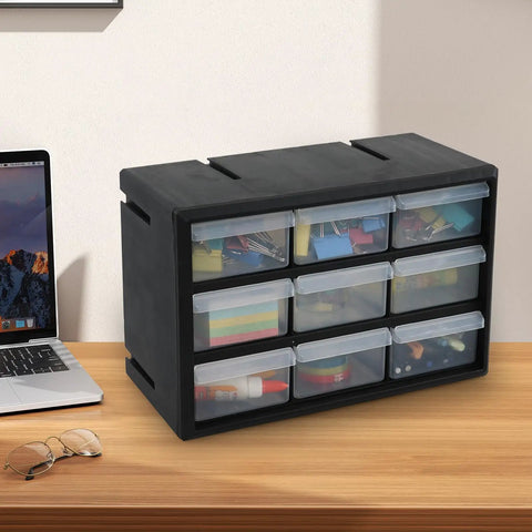 Top Shelf Nine Drawer Plastic Storage Cabinet With Easy Adjust Dividers For No Sweat Organization Small Parts Sorting Craft Supplies And Wall Mount Desktop Tool Box placed on a desk next to a laptop.