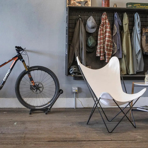 Rakk Bike Storage Rack Freestanding Floor Bicycle Stand For Small Spaces Ideal For Apartments, Garages, Basements, Sheds, And Shops Keeps Bikes Organized And Easy To Access next to modern chair.