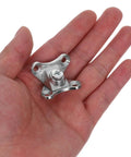 Hand holding Butterfly Corner Brace Brackets 12 Pack Zinc Alloy Silver Shelf Brackets For Cabinets And Beds Easy Install Multifunctional