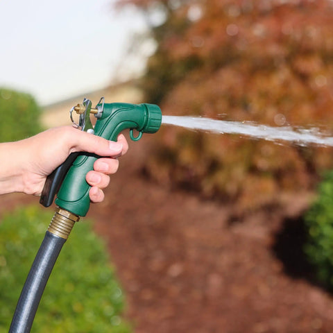 Industrial Spray Nozzle With Quick Connect Set Pro Grade Adjustable Pattern From Gentle Rinse To Powerful Jet Durable Rubberized Grip And Metal Trigger For All Purpose Lawn Watering Threaded Tip Attachments Plus Protective Cover Included being used in a garden