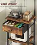 Rustic Brown And Black Bakers Rack With Drawer Microwave Stand Power Outlet And USB Ports Coffee Bar Station close-up.