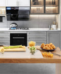Hella Large Heat Resistant Silicone Counter Protector on a kitchen countertop with fresh ingredients and baked goods.