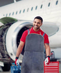 Heavy Duty Cowhide Welding Apron Built To Last For Tough Jobs With Serious Heat Protection And Soldering Defense worn by smiling worker.