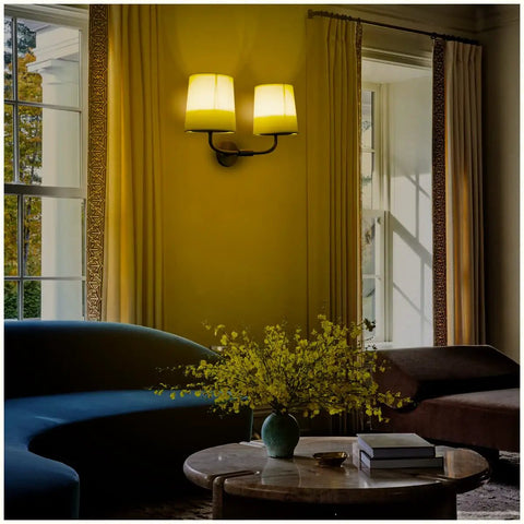 Industrial Battery Powered Wall Sconce With Two Light LED Fixture on a living room wall with yellow fabric shades