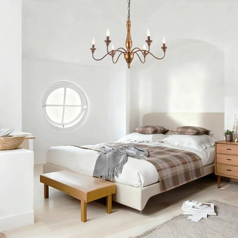 Six Light Distressed White French Country Candle Chandelier With Cozy Vintage Vibe For Living Room Dining Room Bedroom 24 Inch Wide Rustic Ceiling Fixture above a modern bed