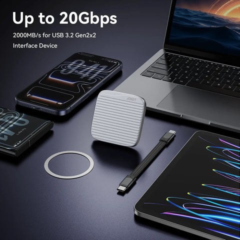 Magnetic External SSD With USB 3.2 Gen 2x2 Up To 2000MBps next to smartphone, tablet, laptop, and magnetic ring