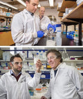 Scientists in lab coats using low form borosilicate glass beaker set with 25ml 50ml 100ml 200ml graduated beakers and 4 pcs 1ml pipettes.