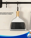 Grab And Go Mini Dustpan And Brush Set With Bamboo Handle hanging on hook, dense soft bristles visible, white dustpan.