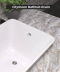 Chrome-plated all-metal lift-and-turn bathtub drain kit with two-hole overflow faceplate installed in white tub