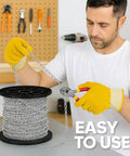 Man using pliers to cut 50 Ft Galvanized Steel Hanging Jack Chain 1.3mm for Light Fixtures, showing ease of use for various applications.