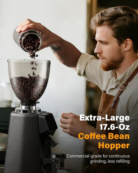 Barista pouring beans into 64mm Burr Coffee Grinder For Home Barista Use With Commercial Grade Precision And 100 Grind Settings