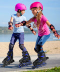 Two children skating with adjustable kids inline skates for boys and girls aged 4 to 12 with lit up wheels, outdoor fun.