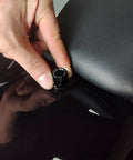 No Sweat Quick Swap Rear Seat Bolt Featuring Carbon Fiber Knob and Aircraft Grade Aluminum being installed on a motorcycle seat.