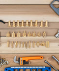 55Pcs Wood Burning Tool Set with metal engraving nibs and replacement tips for pyrography and woodcrafts on a wooden surface.