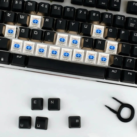 Blue Clicky Mechanical Keyboard Switches Kit 120 Pack, 3 Pin, 50gf Actuation, Dustproof and Water Resistant, Clear Housing for LED Backlit Gaming Keyboards and 3D Printing Projects, Easy Install, Durable, High Quality Feel installed on a black keyboard with keycaps removed