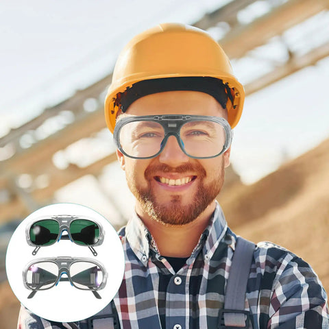 Heavy Duty Pair Of Welding Goggles With Double Layer Plastic Lens Badass Impact Resistant Safety Glasses worn by a smiling worker.
