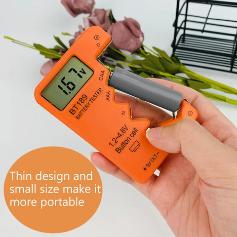 Universal Battery Tester With Digital Display For AA AAA C D 9V 1.5V Batteries Portable Travel Ready Volt Checker For All Battery Types With Clear LCD Readout And Quick Battery Health Gauge Orange Color compact ABS tester in hand with AA battery