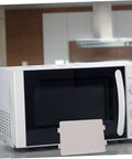 Microwave with a mica sheet for DIY repair, part of the 10 Pack High Temperature Mica Sheets For Microwave Waveguide Covers And Oven Repairs