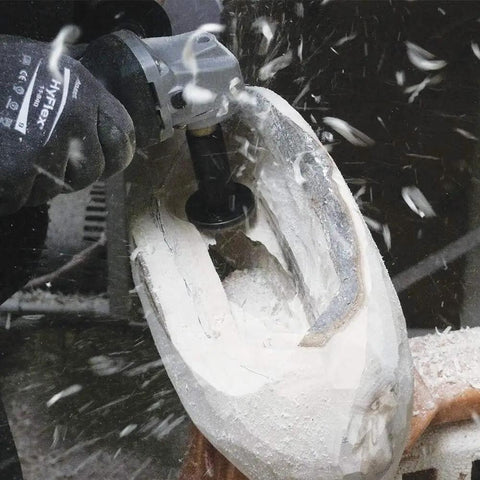 Using Heavy Duty Mini Turbo Angle Grinder Kit With 50 Millimeter Tungsten Cutters for detailed wood sculpting.