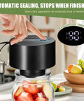 Gurithe Electric Mason Jar Vacuum Sealer With Smart Auto Stop Technology For Fresh Food Storage fits a jar with fruit being sealed.