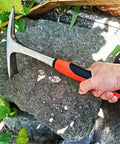 Hand using Heavy Duty 28 Oz Rock Pick And Brick Hammer With Pointed Tip And Flat Head Forged Steel Construction for stone work