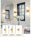 Brushed Gold Vanity Light Fixture Over Mirror With Frosted Milk Glass Sconce in modern bathroom setting.