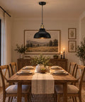 Black Industrial Metal Pendant Light, E26 Curvy Adjustable Ceiling Fixture hanging over a rustic dining table in a warm setting.