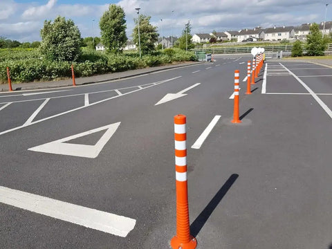 Heavy Duty Flexible Bollard Built Damn Tough For Busy Parking Lots Takes Serious Beating And Springs Back Orange And White High Visibility Traffic Barrier No Fuss Outdoor Setup Solid Heavy Duty Road Guard in parking lot