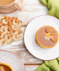 Set Of 100 Realistic Fake Almond And Cashew Nuts For Home Decor And Photography Props One Inch Mini Size on a wooden table with dessert