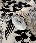 Snag This Killer Big Cat Print PVC Free Wallpaper Featuring A Premium Matte Linen Texture Durable Wallcovering Designed To Level Up Your Interior Design Game Today, showcasing roll with black big cat design and floral details.
