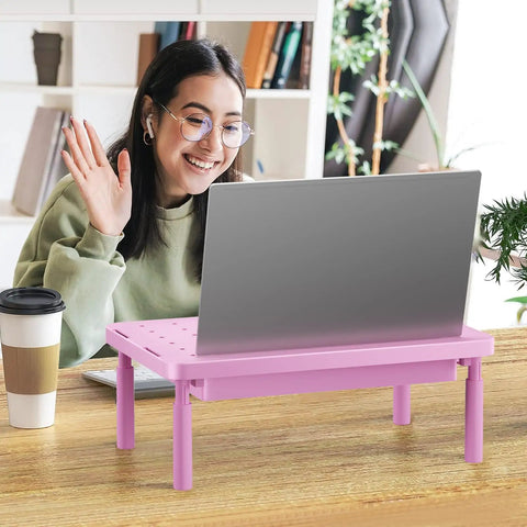 Woman using laptop on Pink Monitor Stand With Storage, Desk Riser And Laptop Elevation, 3 Height Adjustable Levels
