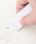 Person using Block White Eraser For Pencils Quick Clean Erasing No Smudge Easy To Use With Minimal Pressure White TPR Material