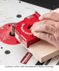 Cutting a radius using the Shop Tested Street Smart Radius And Chamfer Quick Jig Deluxe Set on a router table.