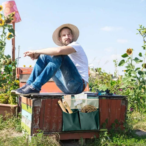 Man sitting outdoors with foldable portable garden tool pouch and kneeling stool bag attached to wooden bench, tools visible
