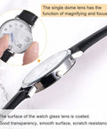 Close-up of 8 Pack 32.5mm Watch Glass Crystal Lenses Single Dome Edge Thickness 1.5mm For Watchmaker Repair Clear Anti Reflection Coated Fits Round Watches DIY Clock And Watch Repair Supplies showing magnifying function.