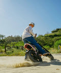 Adult Electric Bike With 1000W Brushless Motor 20Mph Peak Pulls 16Inch Slick Wheels Built To Chomp Potholes And Weave Through Traffic Like A Pro For Chill City Rides in action on sandy terrain.