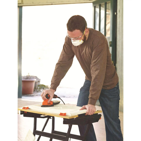 Man using Pro Grade Detail Sander With 1.2 Amp Motor 16,000 OPM Compact Corded Power Three Position Comfort Grip Dust Collector