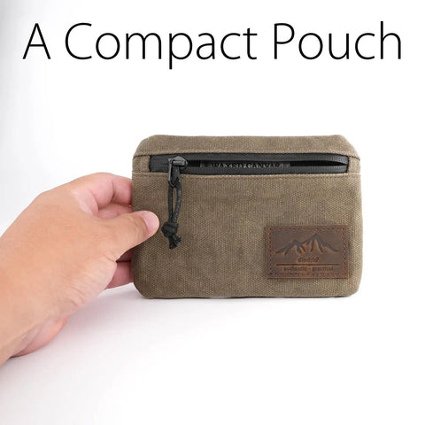 Low Profile Belt Zipper Pouch For Men And Women, Compact EDC Waist Pack With YKK Zipper, shown in olive waxed canvas in hand