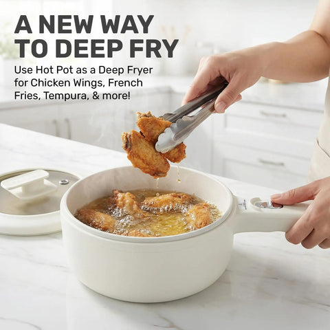 All In One Electric Hot Pot With Steamer And Lid 1.5L Nonstick Ceramic Cooker frying chicken wings in kitchen
