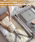 Portable Mini Washing Machine Rechargeable Underwear Cleanser And Makeup Brush Washer Built Different in a suitcase for travel.