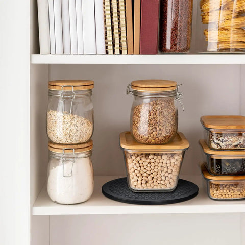 Slick 10 Inch Heavy Duty Swivel Base With A Slim Zero Point Eight Inch Profile And Rock Solid One Hundred Pound Support For Smooth 360 Degree Spin On Any Desk Or Counter For Monitors Plants And Everyday Tech Gear displayed in a pantry with storage jars.