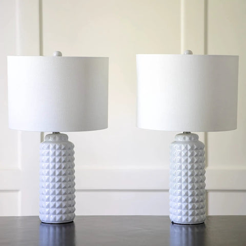 Felix LED Ceramic Table Lamps Set Of 2 In Antique Brass Finish With White Linen Hardback Shade, on a table