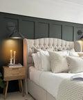 Vintage Wireless Battery Operated Wall Sconces Set Of Two, Dimmable Led Wall Lights With Nifty Remote, Zero Wire Fuss Black Indoor Fixtures For Bedroom Living Room And Hallway, Flat Out Chic Glow above a bed with decorative pillows.