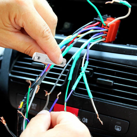 Hands replacing fuse in vintage car using European Type Classic Car Fuse Kit 60 Piece Set For Vintage Vehicles