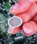 Intelligent Flexible Thin Film Circle Pressure Sensor For Force Sensing Resistor RP-C18.3-ST held on circuit board