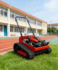 Heavy Duty Lawn Mower Machine For Home Gardens And Sports Fields, all-terrain model on grass near sports track