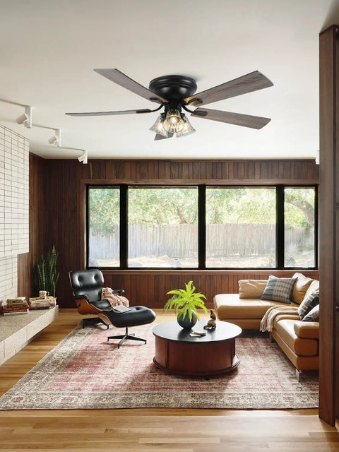 52 Inch Flush Mount Farmhouse Ceiling Fan With Remote And Reversible Wood Blades in modern living room with warm lighting.