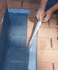 Applying Brushable Black Elastomeric Chimney Flashing Sealant For Waterproof Leak Protection Around Chimneys, Vents And Skylights